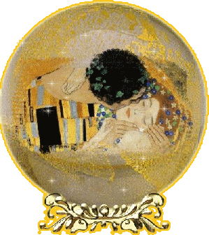 A glittering, gold snowglobe that contains a closeup of 'The Kiss' by Gustave Klimt.